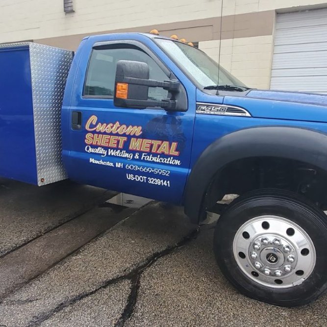 custom sheet metal logo on side of a truck